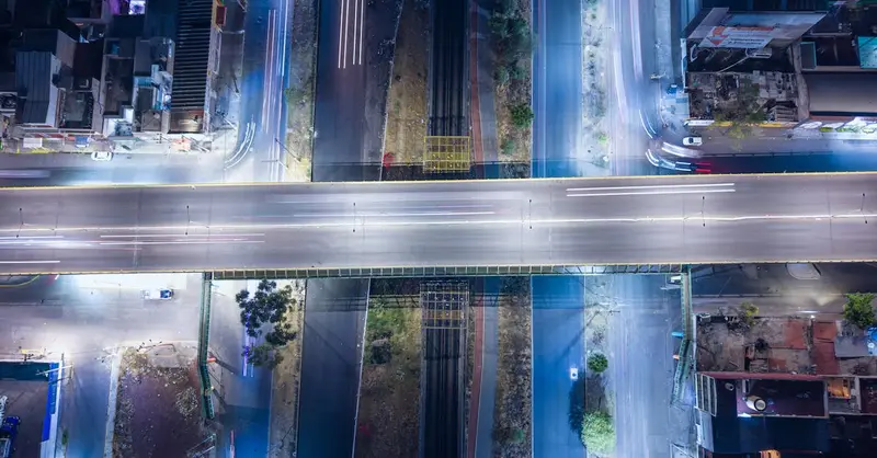 Stunning aerial night view of a highway intersection in Ecatepec, Mexico, showcasing urban infrastructure.