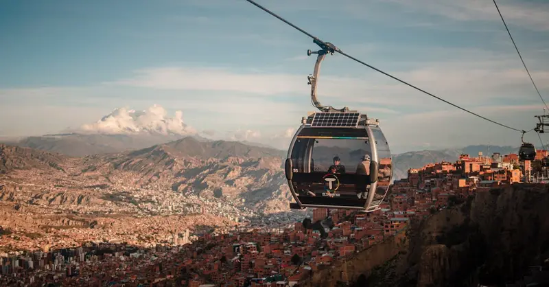 Stunning aerial view of La Paz with cable car transport at sunset.