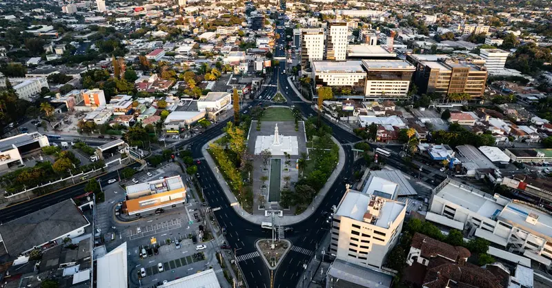 Stunning aerial shot of San Salvador's cityscape centering on the iconic Monumento al Divino Salvador del Mundo.