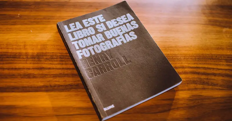 Photography guidebook displayed on a wooden table, highlighting its cover design.