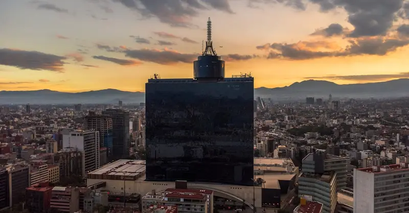 Aerial view of Ciudad de México showcasing the cityscape during a vibrant sunset.