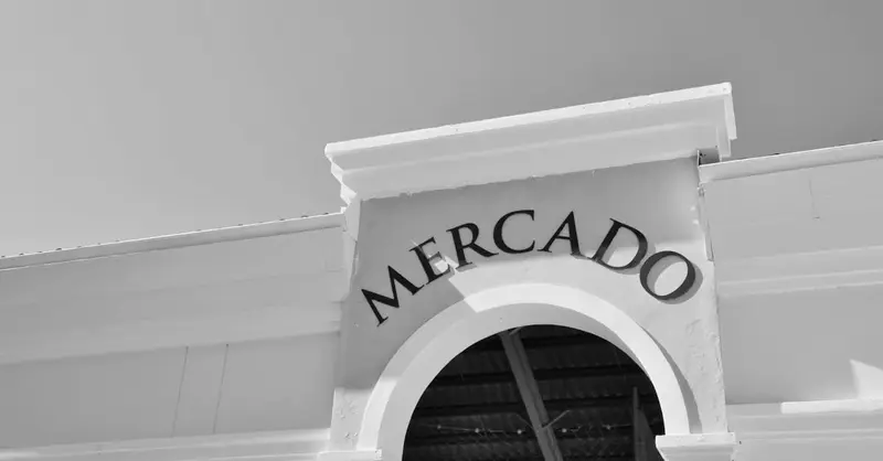 A black and white image of a mercado entrance with arch detail in the Dominican Republic.