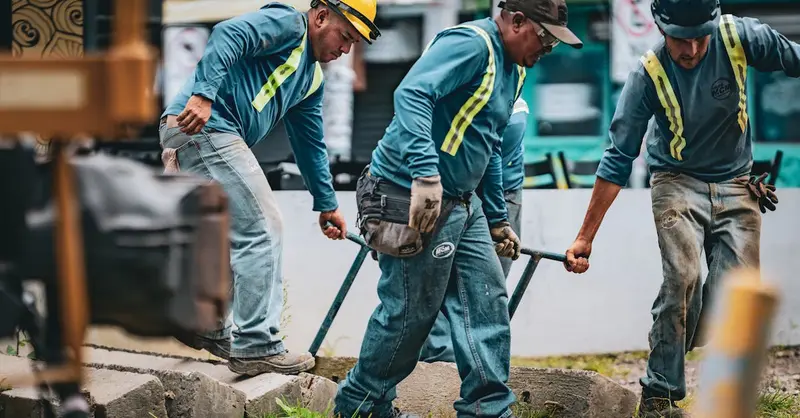 Team of construction workers collaborating on a project in San José, Costa Rica.