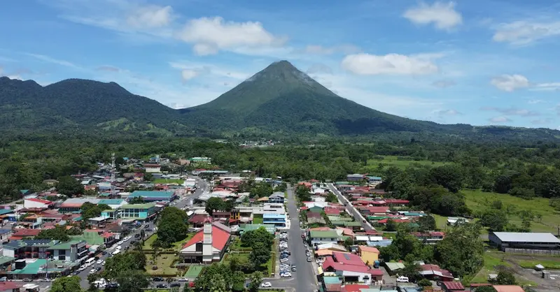 A breathtaking aerial view of La Fortuna with the majestic Arenal Volcano in Costa Rica.