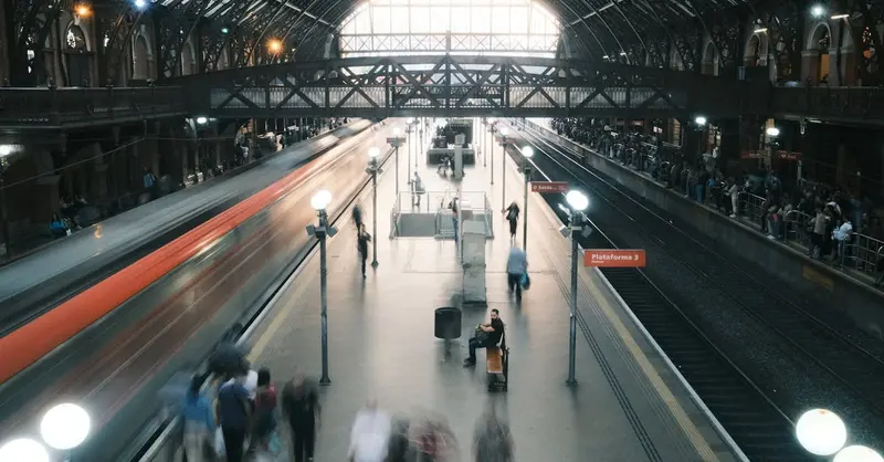 Dynamic city train station with blurred motion capturing urban hustle and movement.