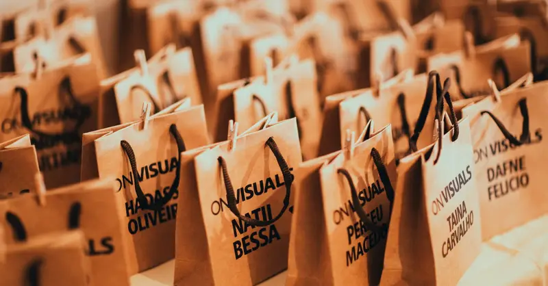 Close-up of eco-friendly paper bags with rope handles, ideal for events and packaging.