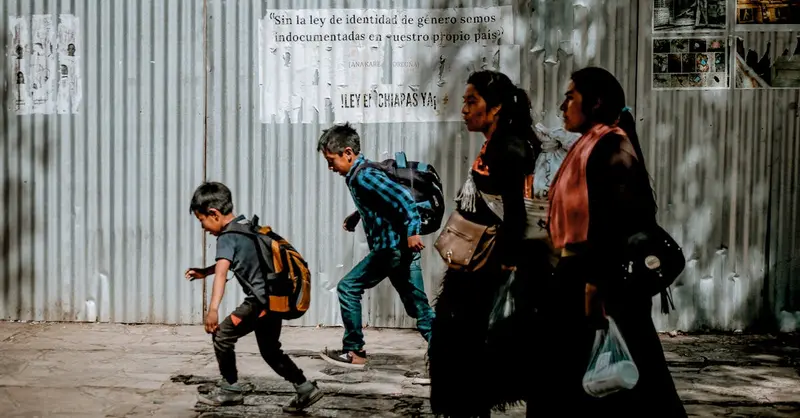 Family walking through shaded streets of San Cristóbal, Chiapas.