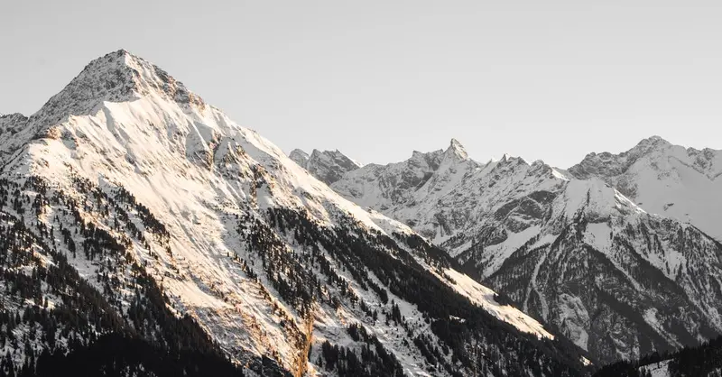 Stunning view of snowy mountain peaks in Zillertal, Austria. A perfect winter landscape.