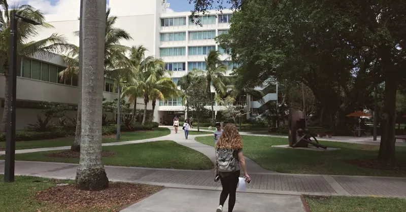 A vibrant university campus scene in Coral Gables, Florida showcasing college life on a sunny day.