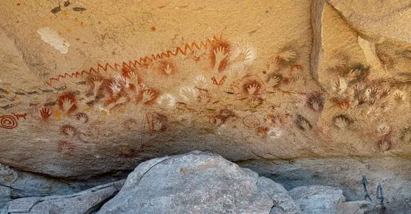 Rock art with handprints at Cueva de las Manos creates a connection to ancient cultures in Santa Cruz, Argentina.
