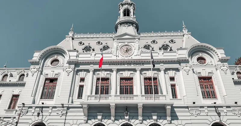 Majestic view of the Armada de Chile building in Valparaíso, Chile, with clear blue skies.