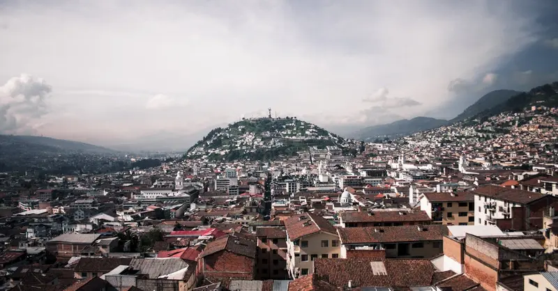 A stunning aerial view capturing the vibrant urban landscape and mountains of Quito, Ecuador.