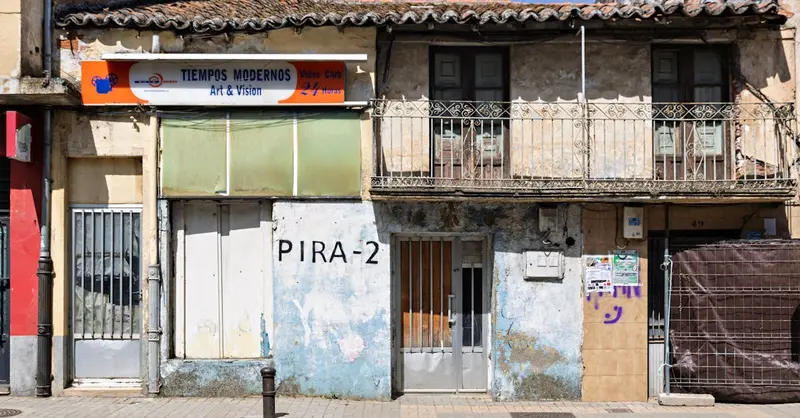 A rustic facade of Tiempos Modernos Video Club in Guijuelo, Spain, featuring vintage architecture and signage.