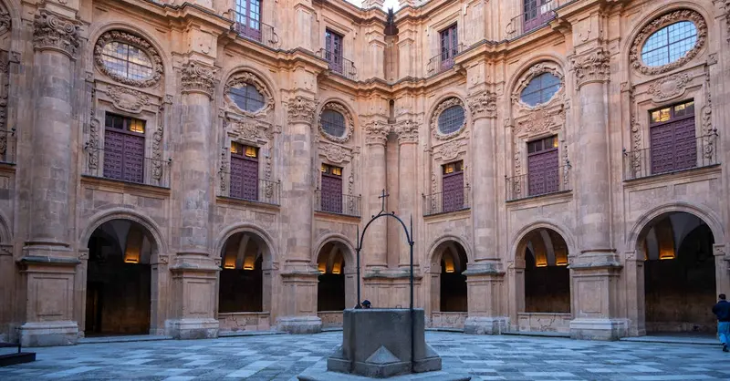 Beautiful stone courtyard of Universidad de Salamanca, showcasing intricate Renaissance architecture.