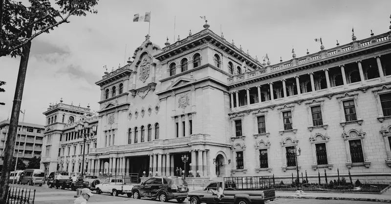 Black and white view of the iconic National Palace in Guatemala City, a significant landmark.