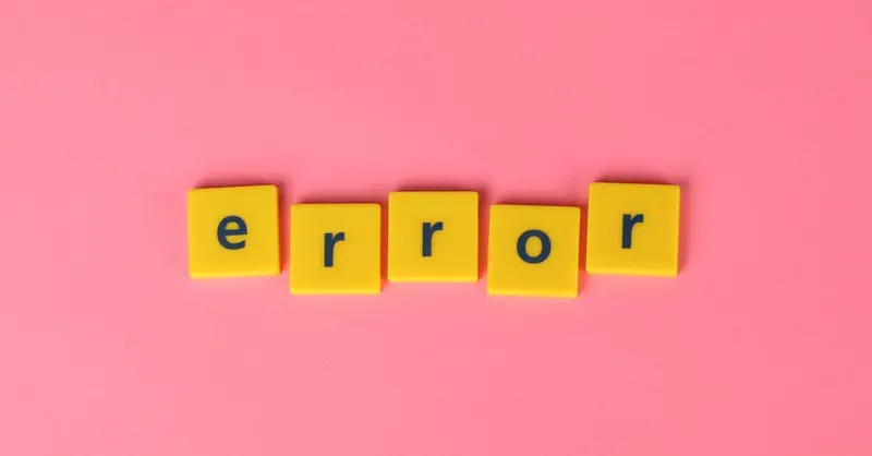 Yellow block letters spelling 'error' on a vibrant pink background, capturing a playful message.