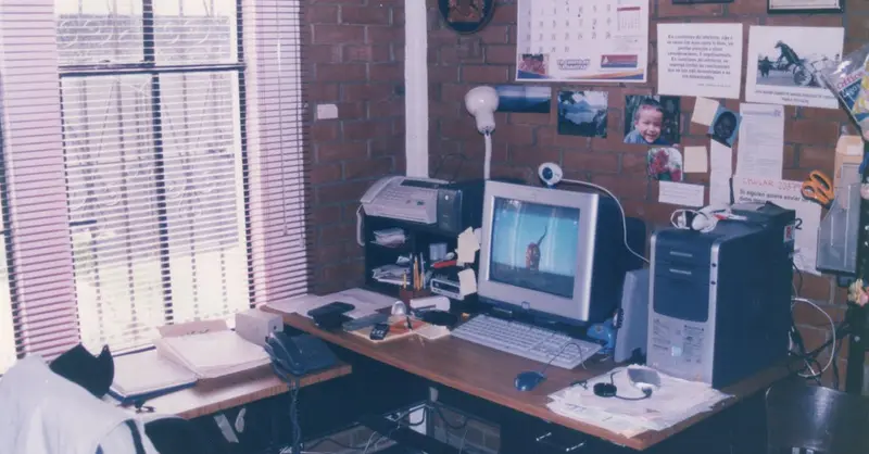 A nostalgic vintage office setup featuring retro technology like a CRT monitor and fax machine in Guatemala City.