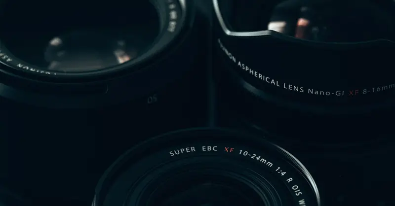 Detailed close-up of camera lenses showcasing modern photography equipment.