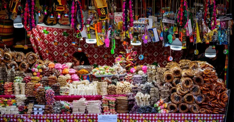 Vibrant candy stall display at a local market in Guatemala City.