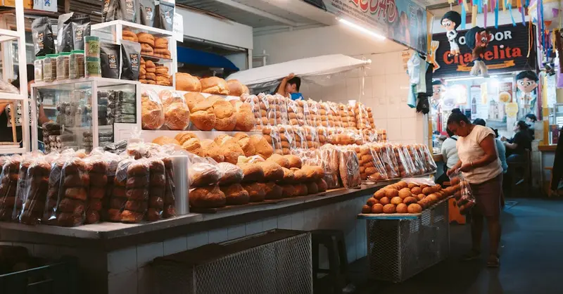 Explore the bustling bread market in Oaxaca de Juárez, filled with diverse baked goods and local culture.