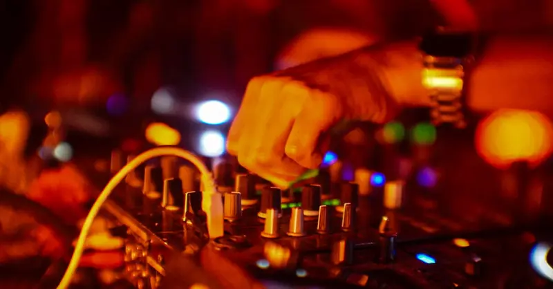 Vibrant DJ performance capturing the essence of night parties in Mexico City with dynamic lighting and music equipment.