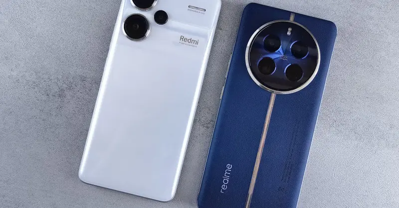 Two smartphones, one white and one blue, displayed on a textured grey background.