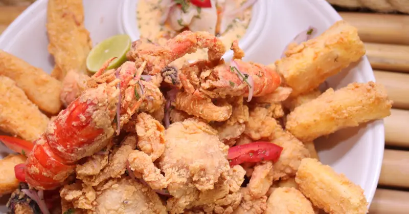 Scrumptious mixed seafood platter served with crispy yuca fries in Arequipa, Perú.