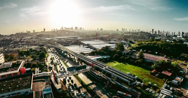 Breathtaking aerial view of San Miguelito, Panama, showcasing vibrant urban life and sunset skyline.