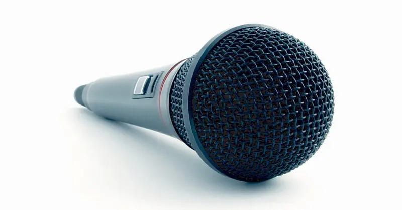Close-up of a condenser microphone illustrating sound recording equipment in a studio setting.
