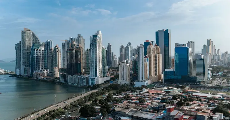 Panama City's contemporary skyline featuring skyscrapers and waterfront, captured under clear skies.