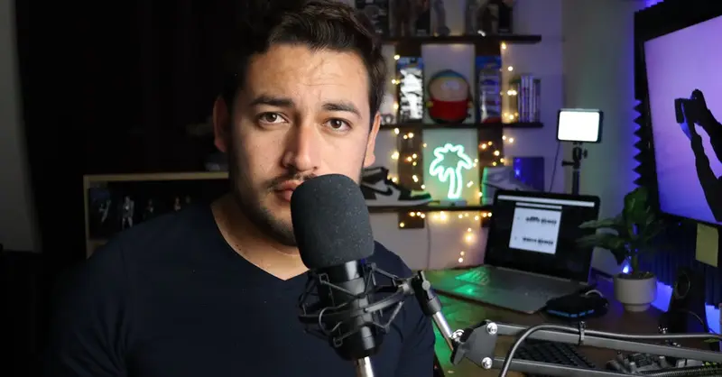 Podcaster in a stylish home studio with microphone and neon lights in Santiago de Querétaro, Mexico.