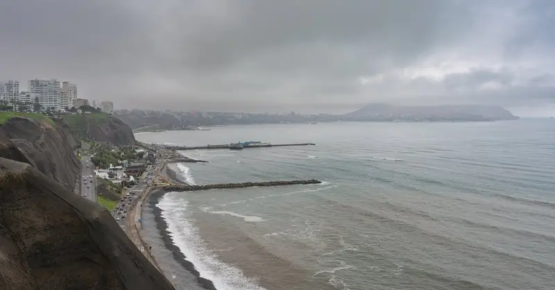 Scenic view of Miraflores overlooking the Pacific Ocean in Lima, Peru. Overcast winter skies add mood to the coastal cliffs.