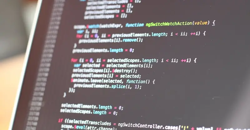 Close-up view of colorful code on a laptop screen, showcasing programming concepts.