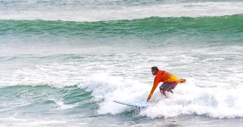 Experience the thrill of surfing in Callao, Lima, captured in vibrant action.