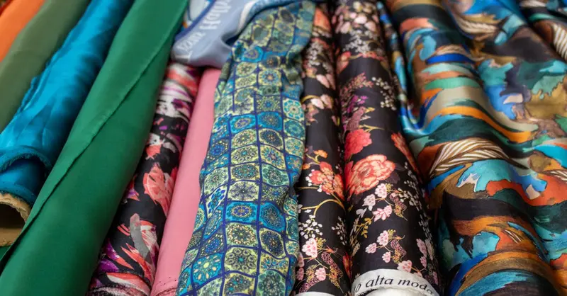 Vibrant selection of patterned fabric rolls showcasing diverse textile designs.