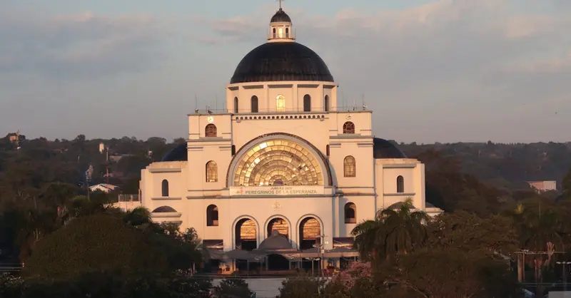 Stunning view of the Basilica of Our Lady in Caacupé during a golden sunset.