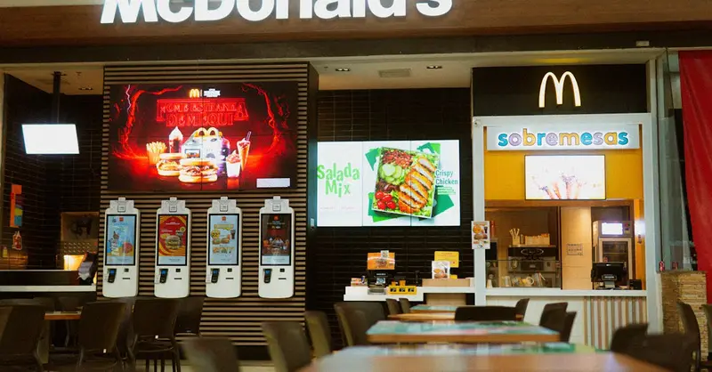 McDonald's fast food restaurant featuring self-service kiosks and digital menus.