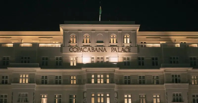 Stunning nighttime facade of the historic Copacabana Palace in Rio de Janeiro.