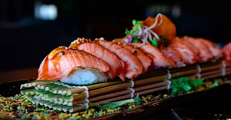 Delight in a beautifully arranged salmon sushi platter, perfect for food lovers and culinary enthusiasts.