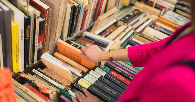 A person browsing colorful books in a charming bookstore in Mexico City, emphasizing culture and knowledge.