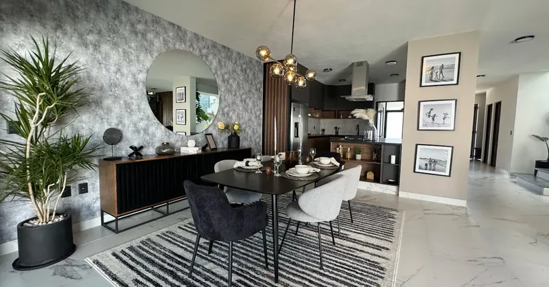 Stylish modern dining room featuring elegant decor and natural lighting for a luxurious ambiance.