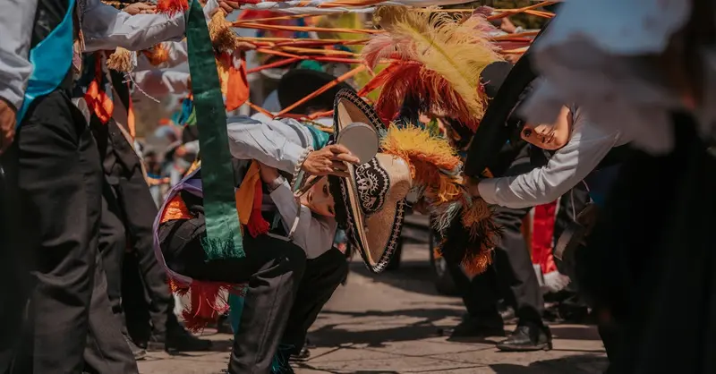Vibrant Mexican festival dance performed in the streets of Puebla, Mexico.